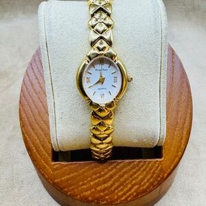 Vintage Givenchy Gold Women's Watch with Roman Numerals